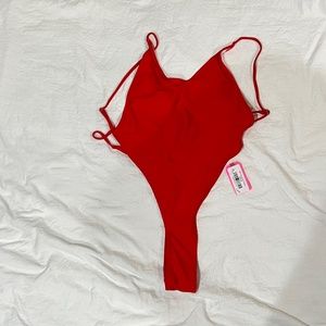 Red high French cut thong one piece bikini